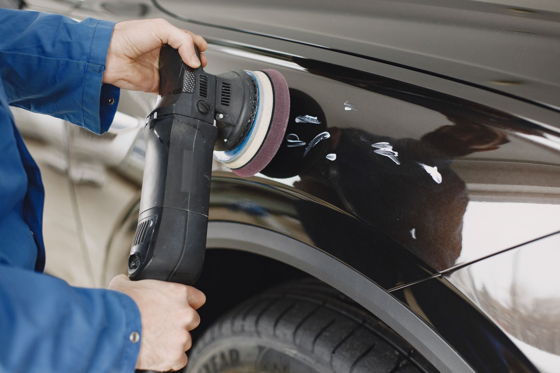 Stock photo of a vehicle surface being polished