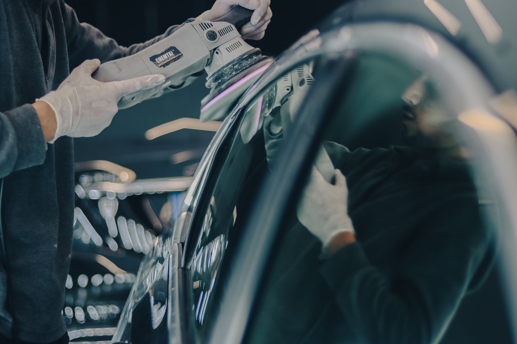 Stock photo of a polishing machine working across a vehicle surface
