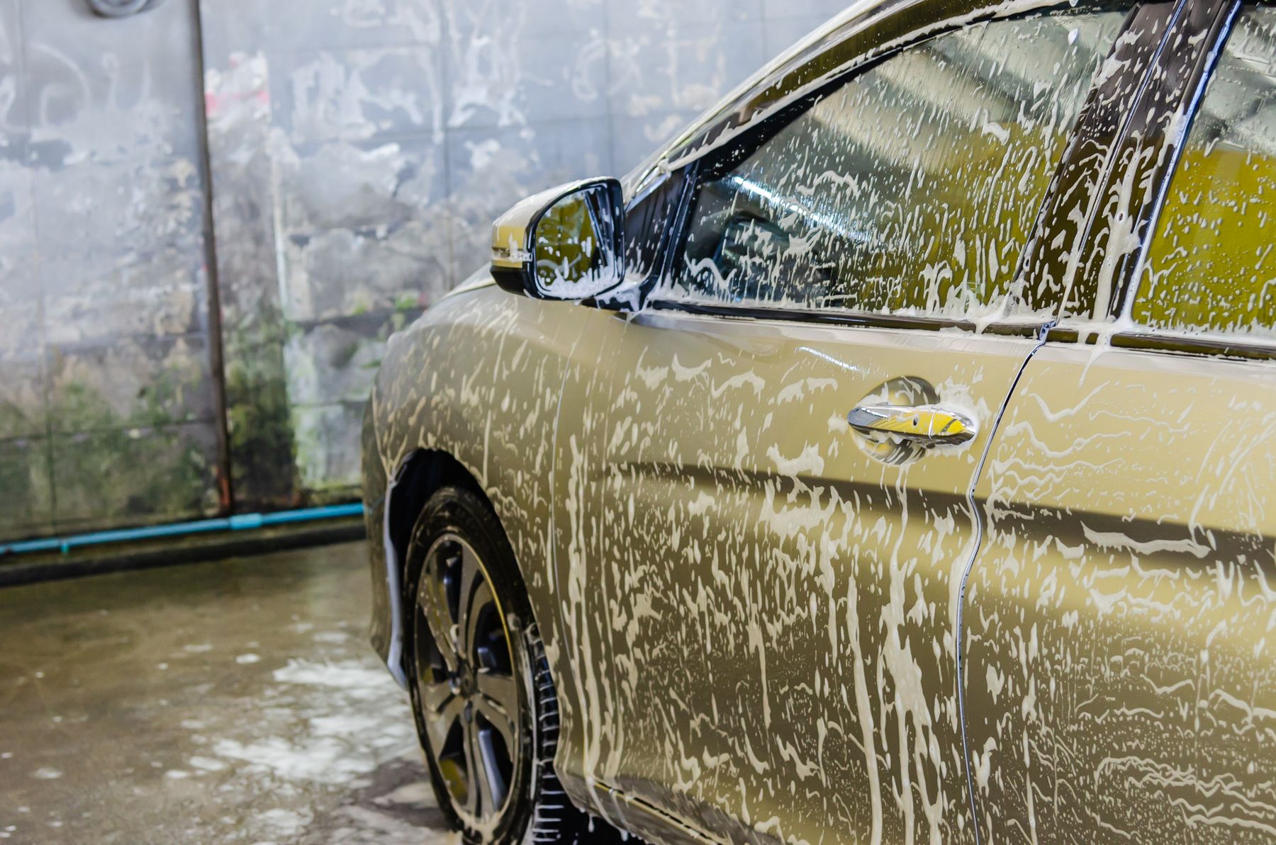 Stock photo of a vehicle covered with wash foam